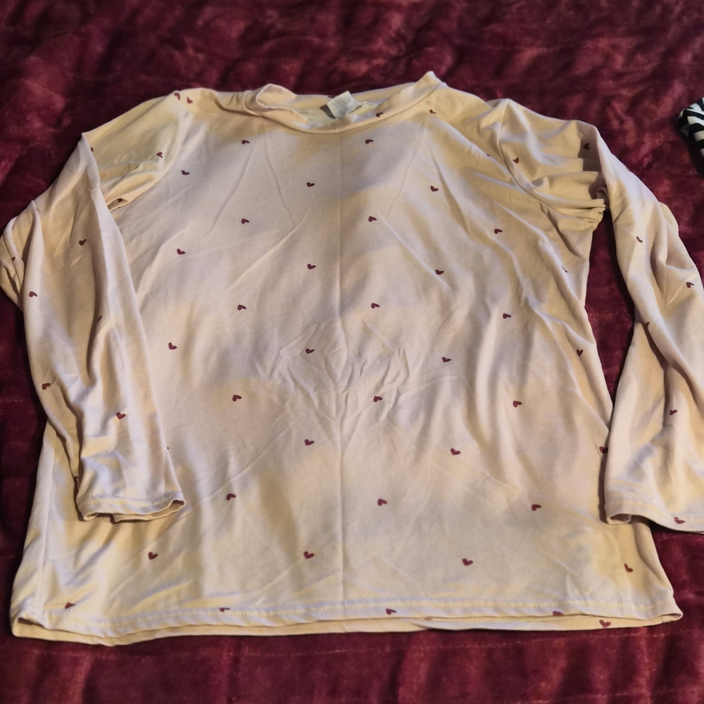 Chic Cream Long Sleeve Top with Red Heart Details